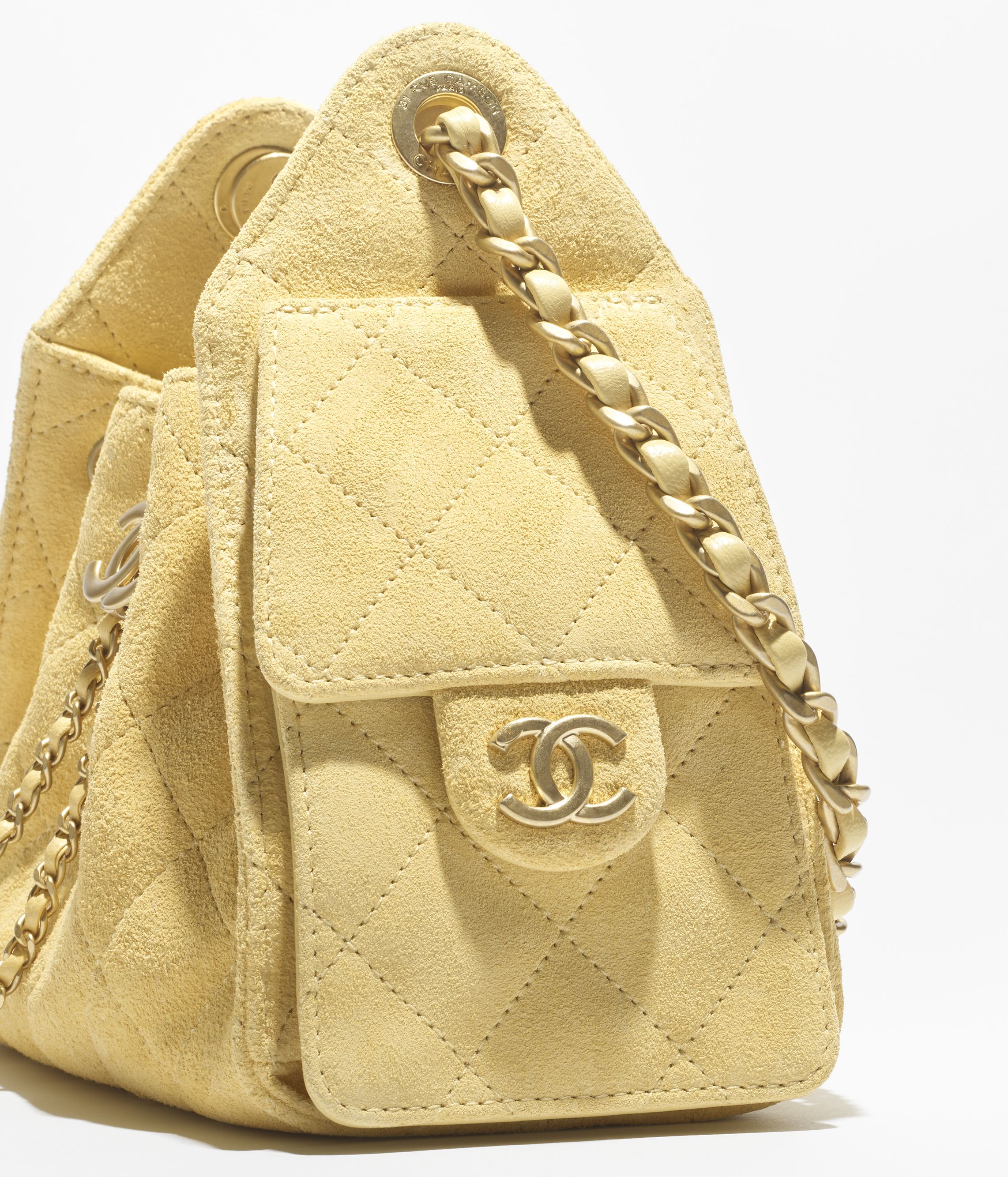Chanel 25 mini handbag, Suede calfskin & gold-tone metal, yellow