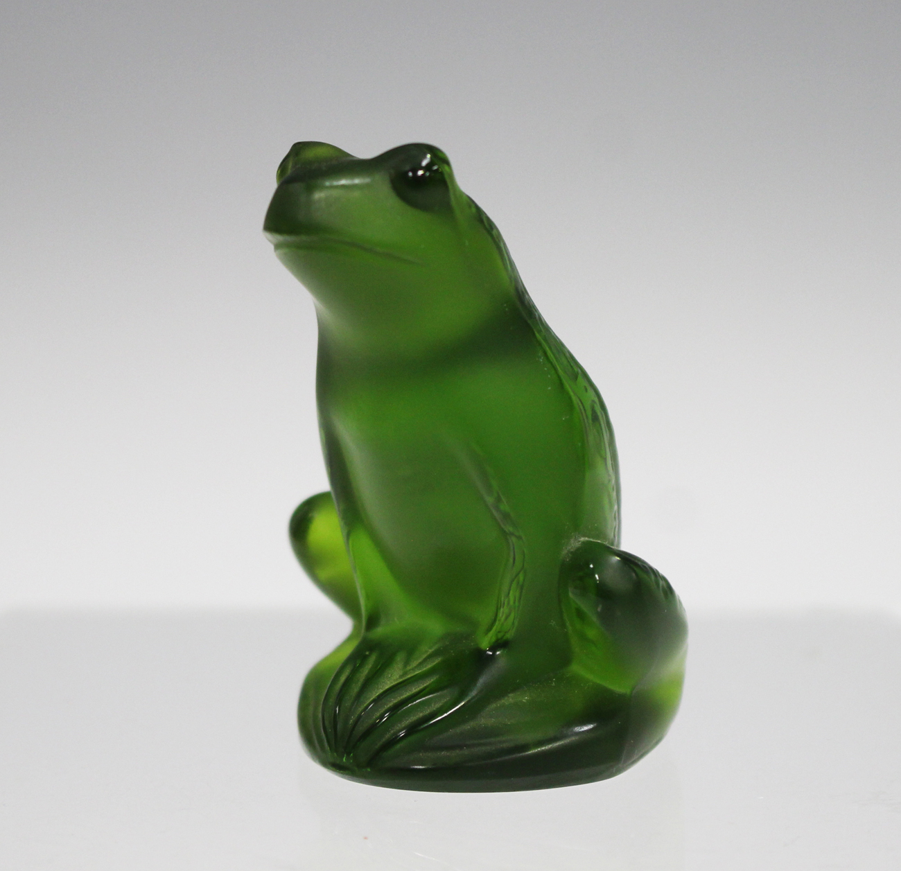 A Lalique glass model of a frog, modern, of dark green tint
