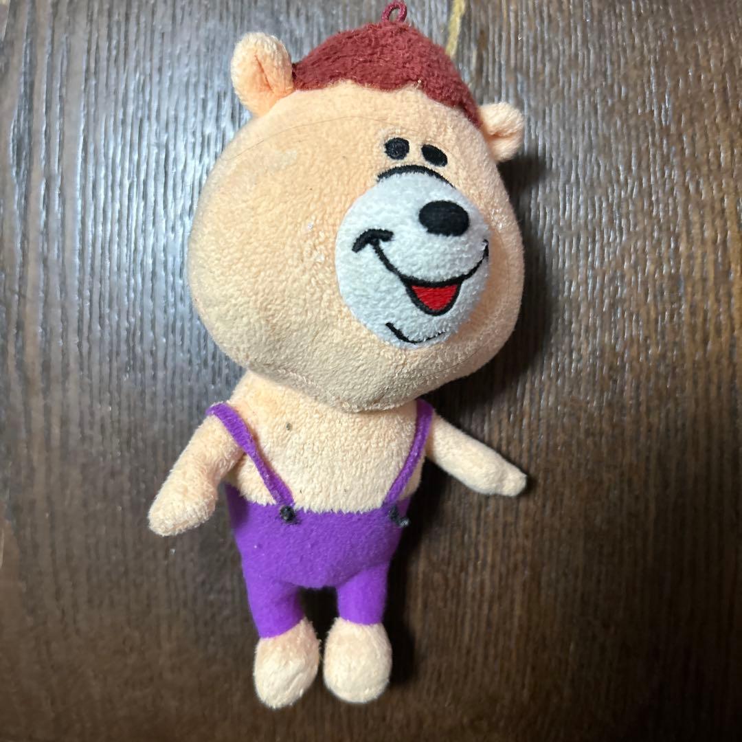 クマのぬいぐるみ 紫のオーバーオール