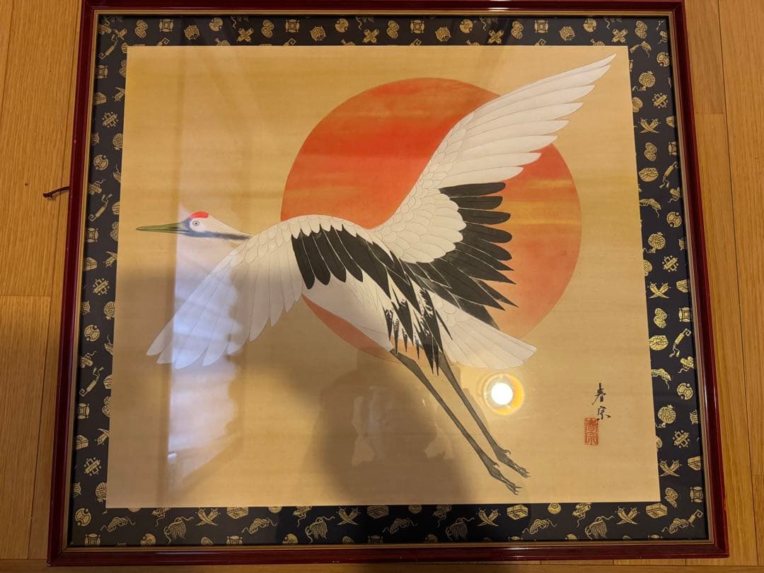 鶴が太陽に飛んでいる作品「飛翔」の木版画