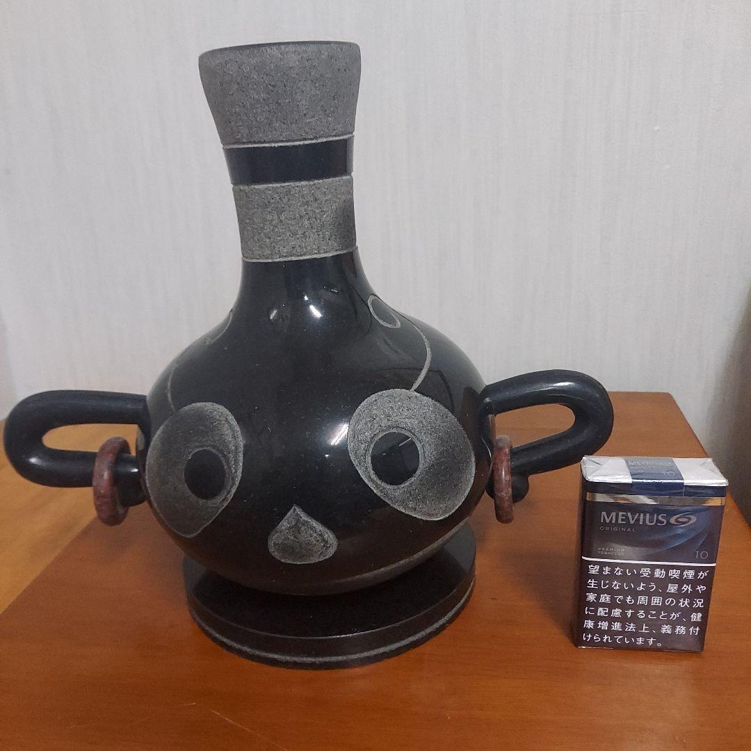 顔の形の黒色石製品置物25㎝